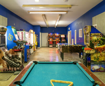 Game Room with Pool Table and Arcade Games