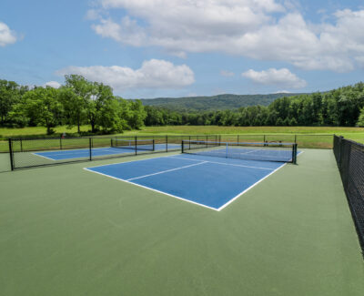 Pickleball Courts at Endless Caverns with trees in background