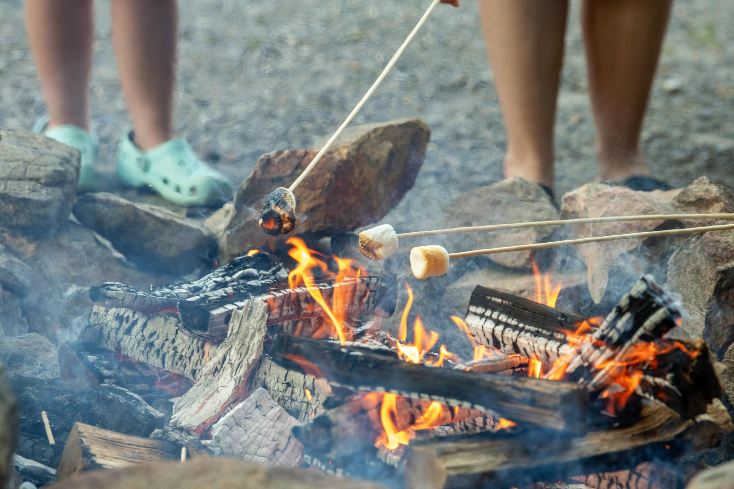 People roasting marshmallows over a campfire