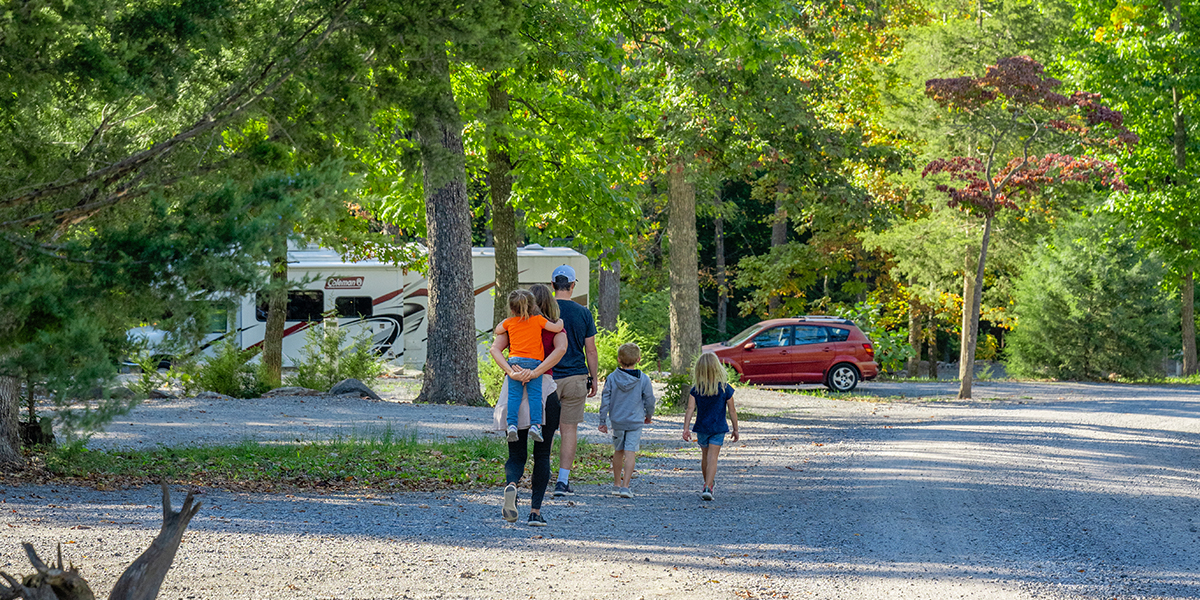 Family walking back to a camper at Endless Caverns RV Resort